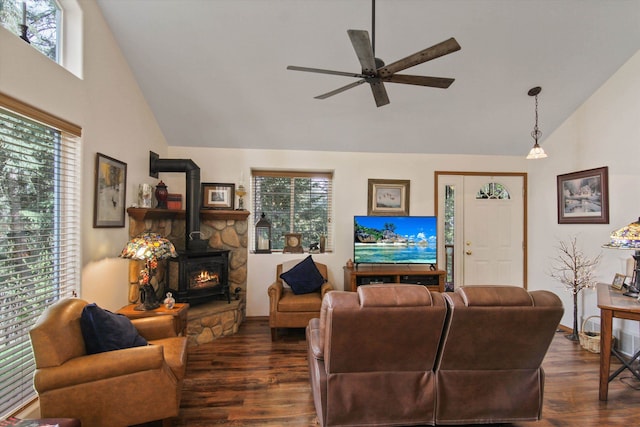 9306 E Lake Rd, Elk, WA 99009 - living area featuring dark wood-style flooring, a wood stove, high vaulted ceiling, a ceiling fan, and a healthy amount of sunlight