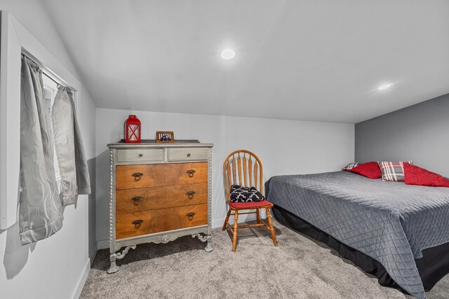 carpeted bedroom featuring baseboards and recessed lighting