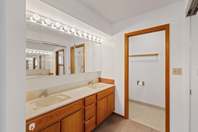 bathroom featuring double vanity and a sink