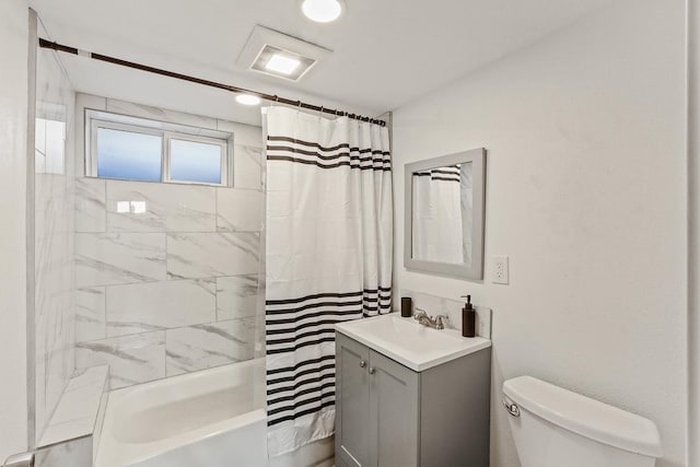 bathroom with toilet, visible vents, shower / tub combo, and vanity