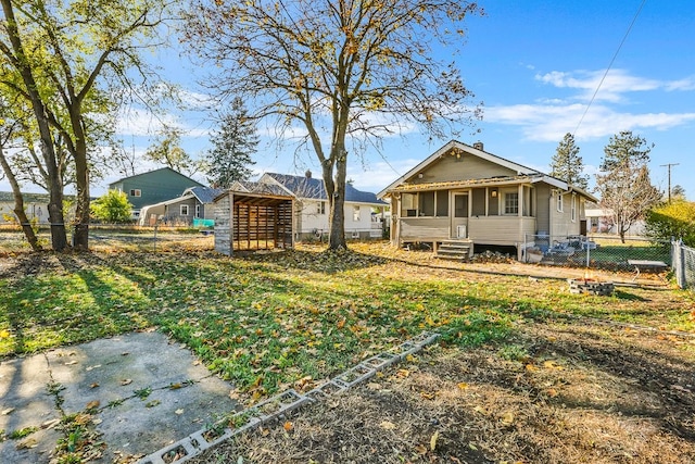 view of yard with a fenced backyard and a sunroom
