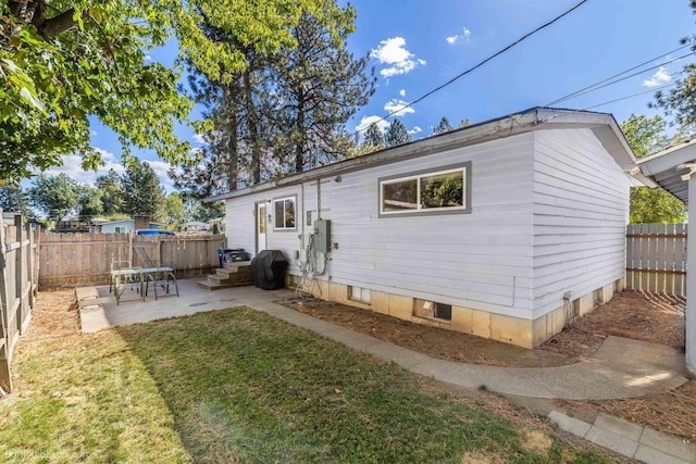 6503 N Calispel St, Spokane, WA 99208 - back of house with a yard, a patio, and a fenced backyard
