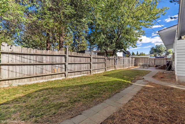6503 N Calispel St, Spokane, WA 99208 - view of yard featuring a fenced backyard and a patio area
