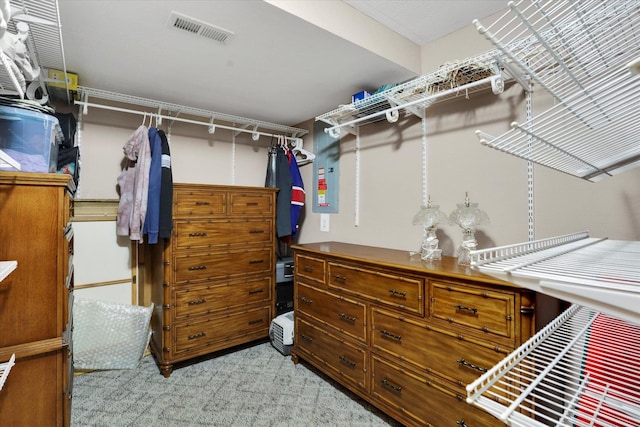 spacious closet with visible vents and light carpet