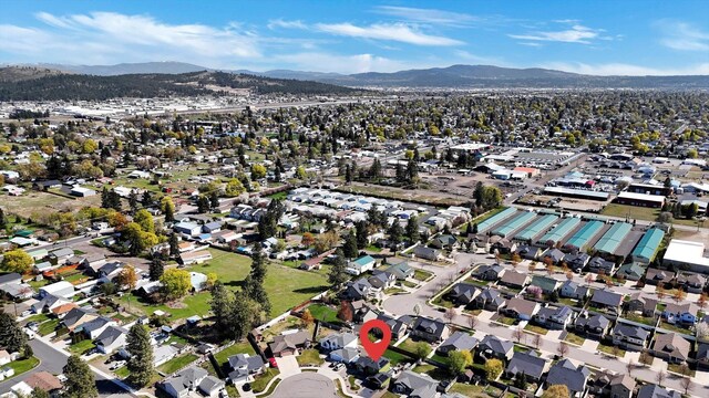 aerial view featuring a mountain view and a residential view