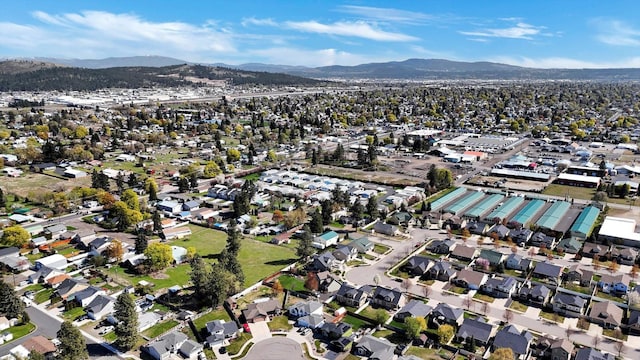 drone / aerial view with a residential view and a mountain view