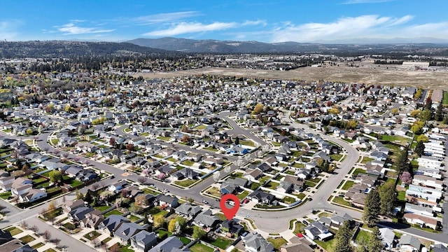 birds eye view of property featuring a residential view and a mountain view