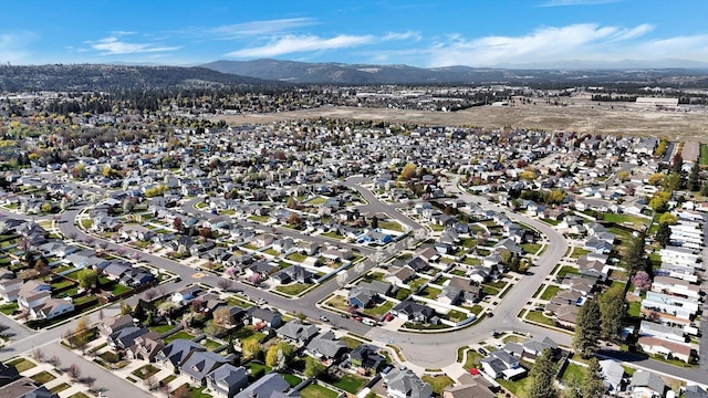 birds eye view of property featuring a mountain view and a residential view