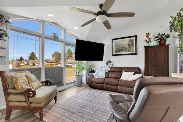 living room featuring recessed lighting, wood finished floors, ceiling fan, and lofted ceiling