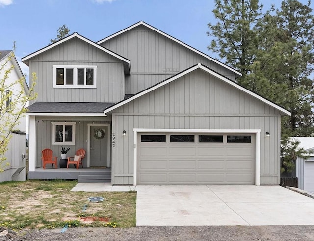 2942 W 18th Ave, Spokane, WA 99224 - view of front of house featuring a porch, concrete driveway, a shingled roof, and an attached garage