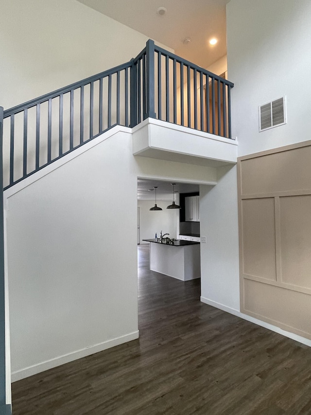 2942 W 18th Ave, Spokane, WA 99224 - stairs featuring a high ceiling, visible vents, wood finished floors, and baseboards