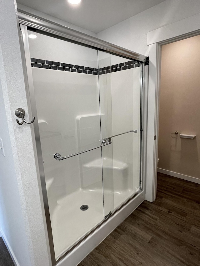 2942 W 18th Ave, Spokane, WA 99224 - full bath with baseboards, a stall shower, toilet, and wood finished floors