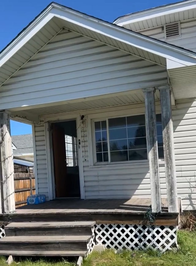 doorway to property with fence