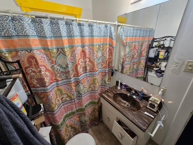 bathroom with vanity, toilet, and a shower with curtain