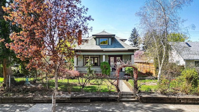 view of front of home featuring covered porch, a gate, and a fenced front yard