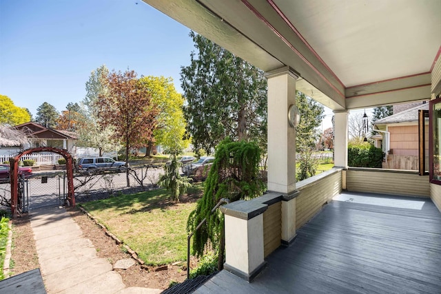 exterior space featuring a gate, fence, and a porch