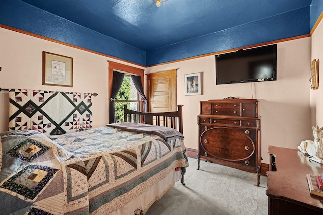 carpeted bedroom with baseboards