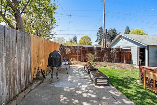 view of patio with a fenced backyard and an outdoor structure