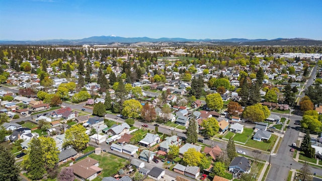 birds eye view of property with a mountain view and a residential view