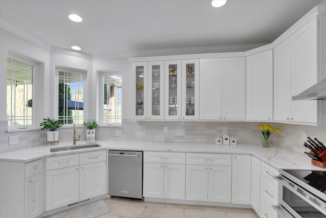 kitchen with tasteful backsplash, stainless steel dishwasher, plenty of natural light, a sink, and range with two ovens