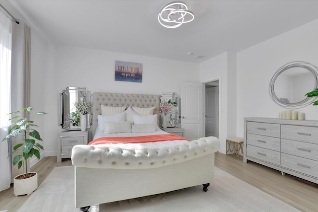 bedroom with light wood-style floors