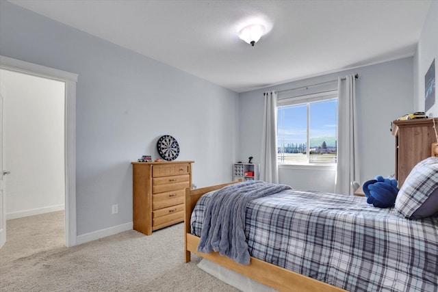 carpeted bedroom with baseboards