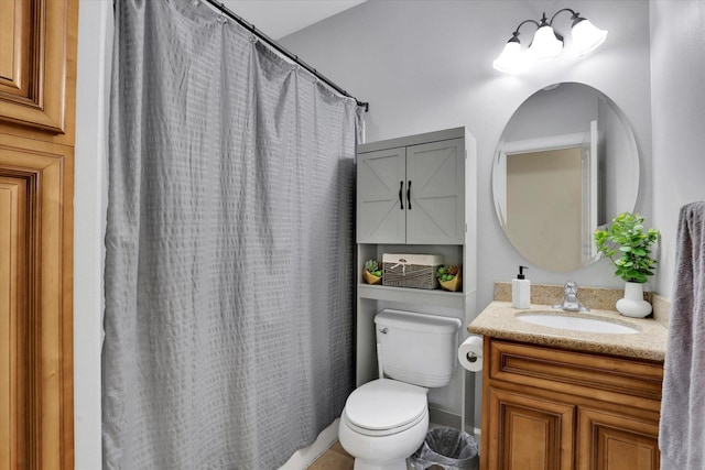 bathroom featuring toilet, vanity, and a shower with shower curtain