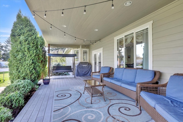 deck with french doors and an outdoor living space