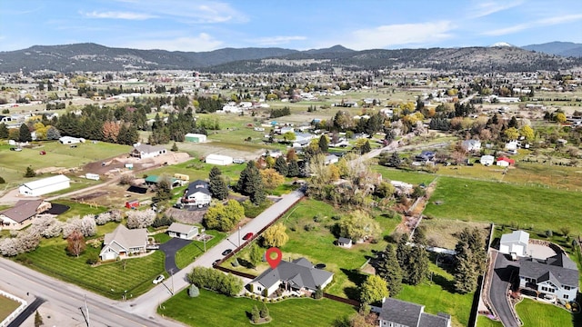 bird's eye view with a residential view and a mountain view