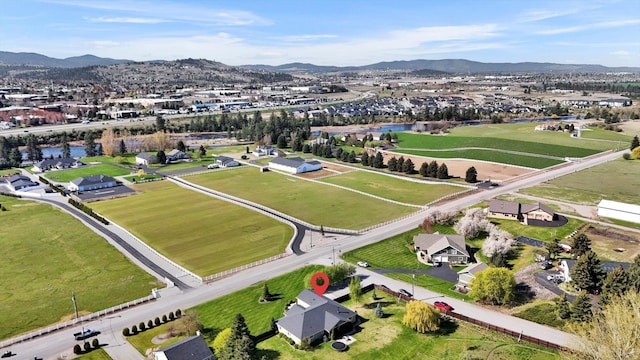 drone / aerial view featuring a residential view and a water and mountain view