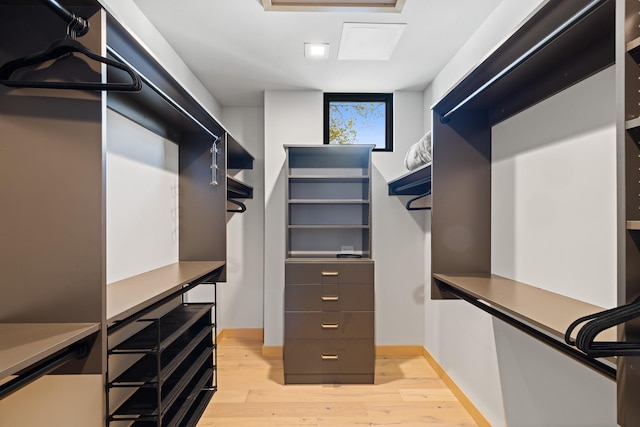 spacious closet with light wood-style floors