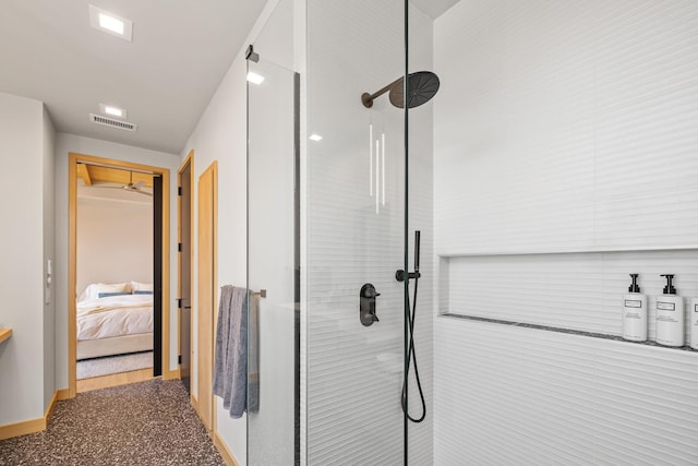 full bathroom with visible vents, baseboards, tiled shower, and ensuite bath
