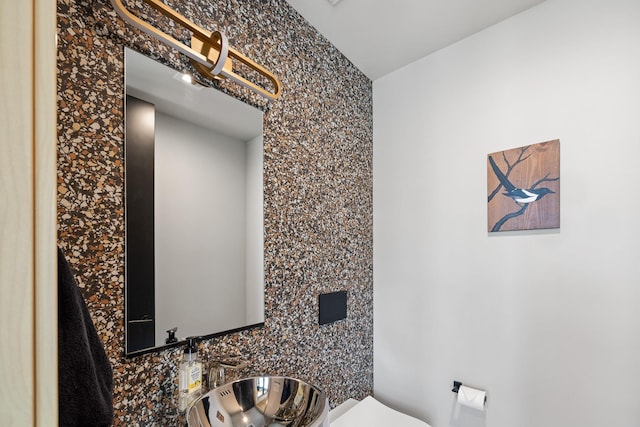 half bathroom with toilet and a sink