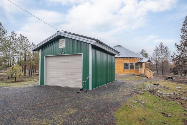 detached garage featuring driveway