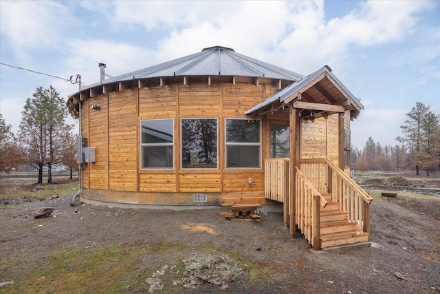 back of property featuring crawl space