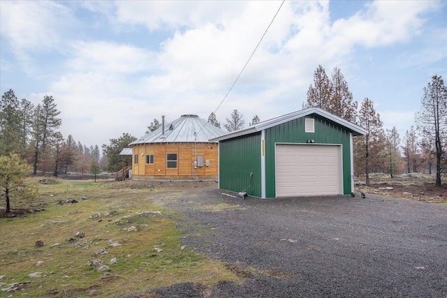 detached garage featuring driveway