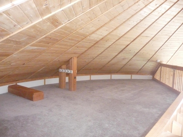 additional living space with wooden ceiling, carpet, and lofted ceiling