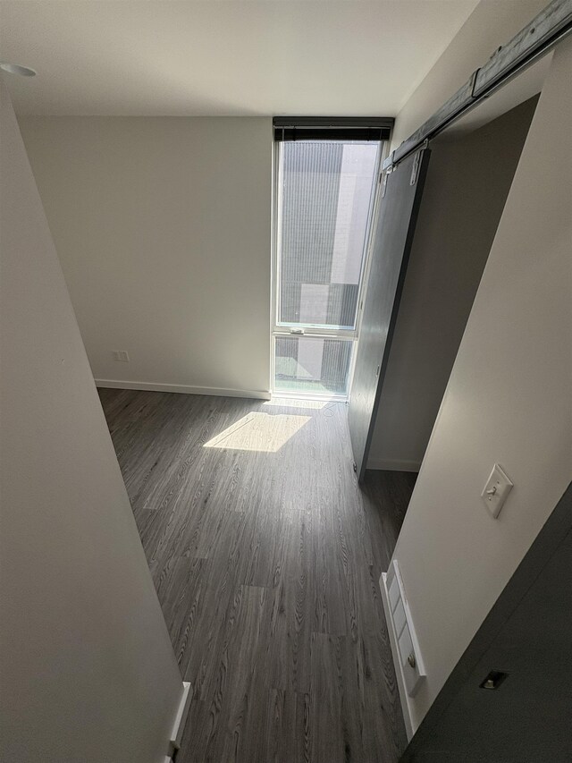904 E Indiana Ave, Spokane, WA 99207 - hallway with dark wood finished floors and baseboards