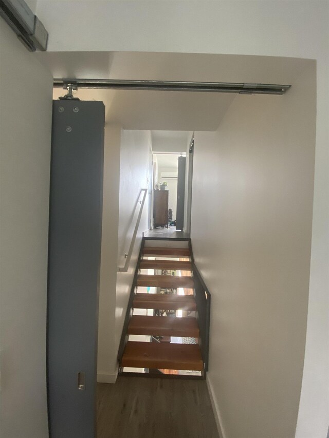 904 E Indiana Ave, Spokane, WA 99207 - stairway featuring wood finished floors and a wall mounted air conditioner