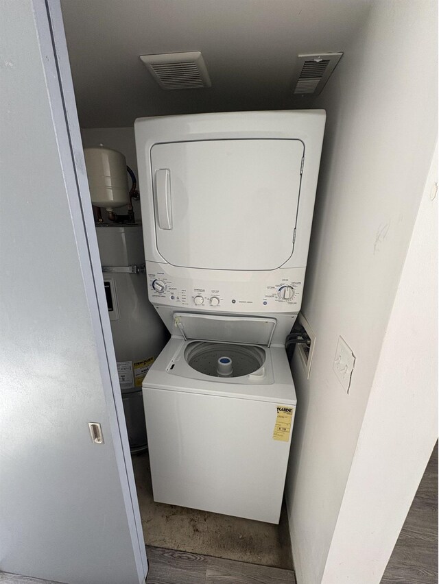 904 E Indiana Ave, Spokane, WA 99207 - washroom with stacked washing machine and dryer and electric water heater