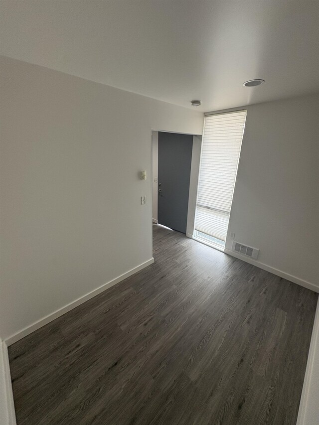 904 E Indiana Ave, Spokane, WA 99207 - unfurnished room with dark wood finished floors and baseboards
