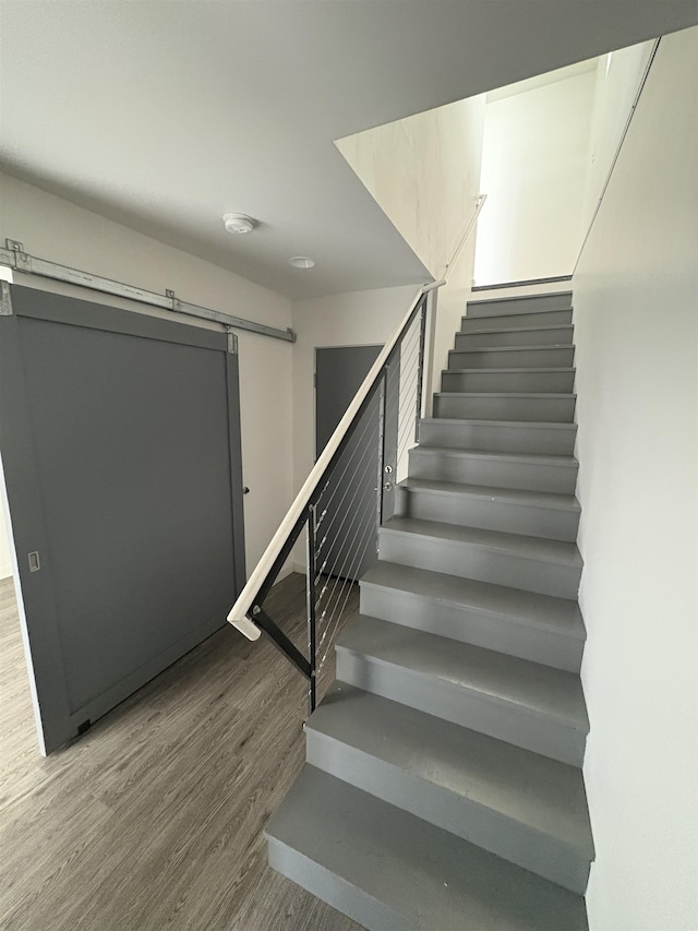 904 E Indiana Ave, Spokane, WA 99207 - staircase with a barn door and wood finished floors