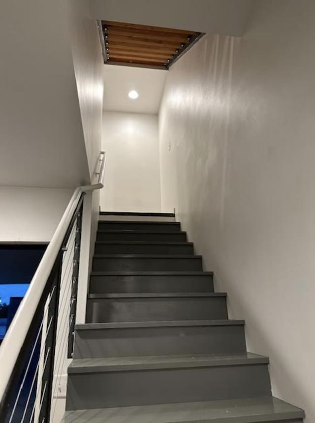 stairway featuring recessed lighting