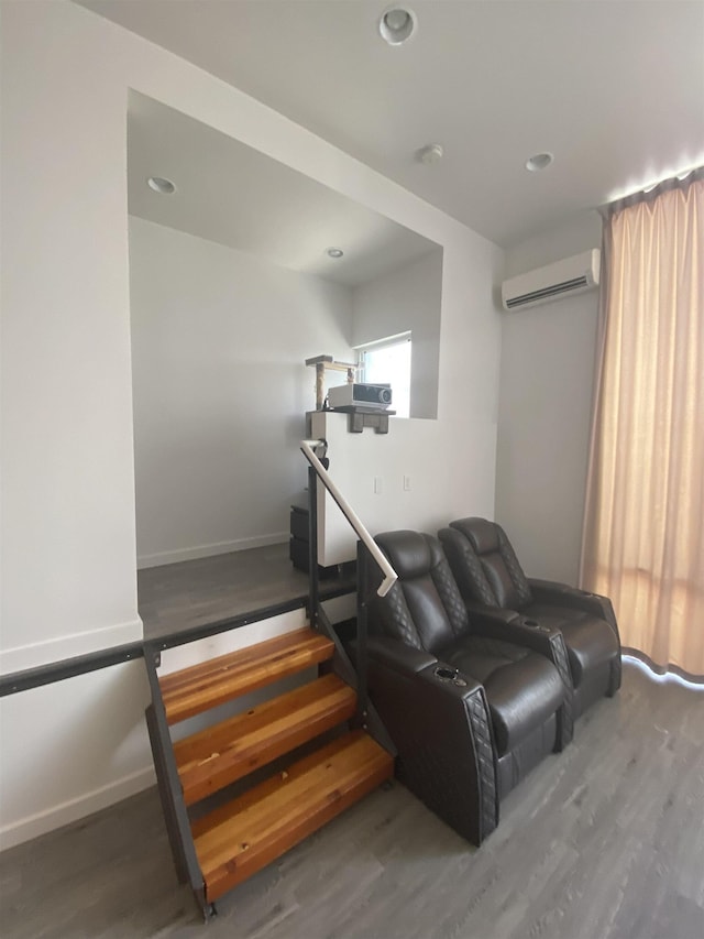 interior space with recessed lighting, wood finished floors, and a wall mounted air conditioner