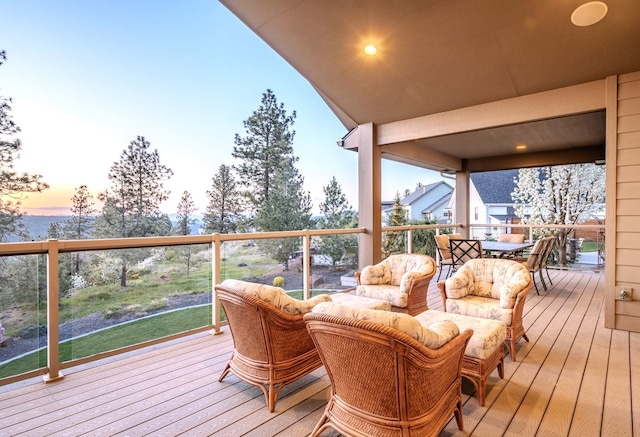 deck with outdoor lounge area and outdoor dining space
