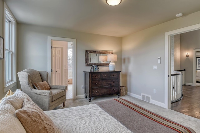 bedroom with baseboards, visible vents, multiple windows, and carpet