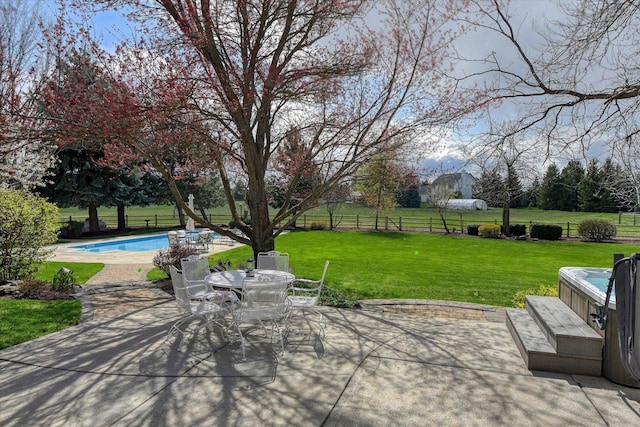 view of patio / terrace featuring a fenced in pool and fence