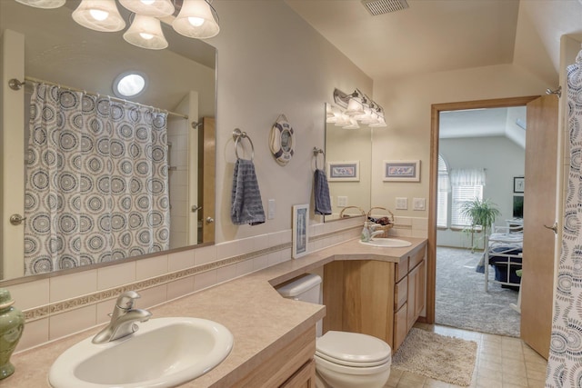 bathroom with visible vents, decorative backsplash, vanity, toilet, and a shower with curtain