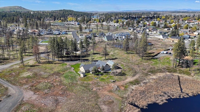 drone / aerial view featuring a mountain view and a residential view