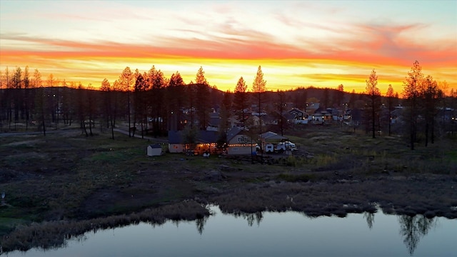 aerial view at dusk with a water view